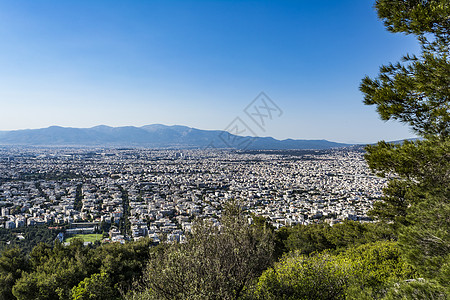 雅典的景象来自希腊的希拉里海美特斯山阳光景观公园房屋首都天空模仿者城市树木建筑物图片