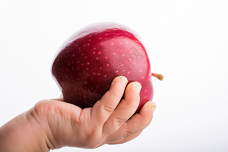 握着苹果的小小孩手水果白色绿色食物红色饮食图片