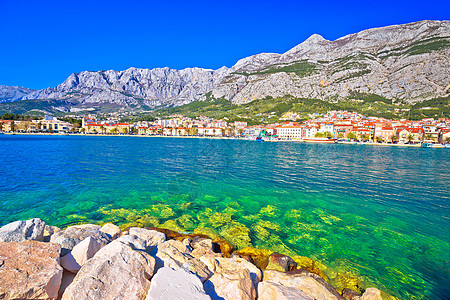 Makarska 松石海滨和比科沃山地观海岸峡谷蓝色游艇石头棕榈历史性城市天线悬崖图片