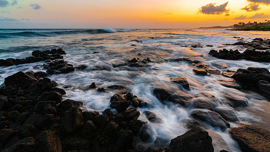 Kauai夏威夷海滩日落海浪热带游客太阳假期天空波浪绿洲运动海岸图片