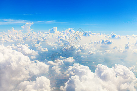 通过平面窗口的美丽的天空视图气候阳光天气雨云飞机季节照片旅行运输蓝色背景图片