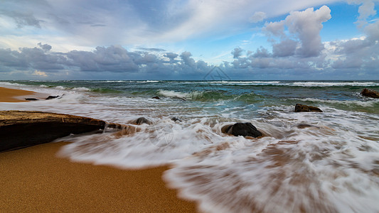 Kauai夏威夷海滩日落海浪假期绿洲游客海洋岩石天空海湾热带运动图片