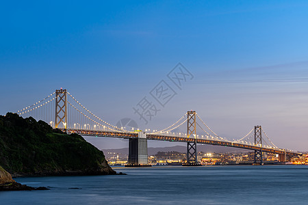 奥克兰湾大桥旧金山湾桥日落景观天际天空办公室运输摩天大楼市中心城市商业背景