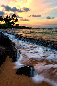 Kauai夏威夷海滩日落海浪绿洲太阳运动旅行阳光游客海湾天空支撑图片