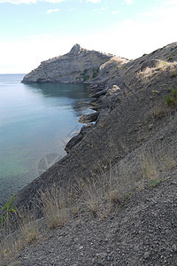 深黑海岸上美丽美丽的山峰高高岩石石头海洋海岸悬崖蓝色假期天空场景海湾图片