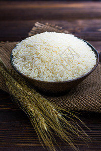 白饭在碗里 稻田耳朵在木制桌子上食物种子农场棕色白色黄色文化粮食谷物小麦图片
