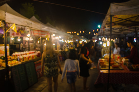 模糊的人走在节日食物背景派对店铺餐厅潮人小贩文化帐篷城市摊位图片