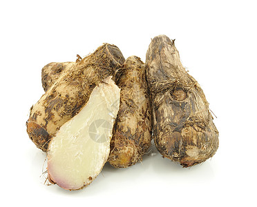 白色上的塔罗根水果芋头热带异国团体食物情调球茎蔬菜背景图片