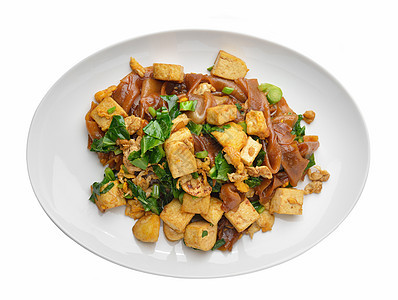面条和豆腐软垫蔬菜猪肉白色盘子油炸午餐食物餐厅图片