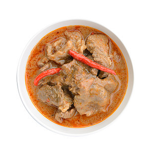 Panaeng咖哩是一种泰国咖喱餐厅椰子美食午餐红色牛奶食物猪肉图片