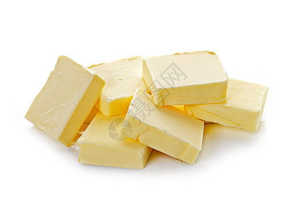 白色背景上的黄油黄色卷曲脂肪食物工作室产品盘子奶制品图片
