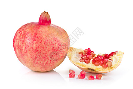 白色背景上的石榴红色饮食热带食物水果种子甜点图片