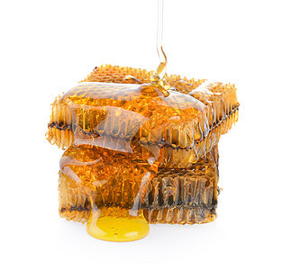 白色背景的蜂窝蜜蜂甜点食物蜂蜡产品黄色橙子金子营养梳子图片