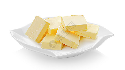 白色背景的陶瓷板(漂亮形状)中的黄油背景图片