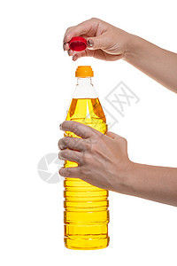 手头有装瓶的植物油玉米瓶装女性女士蔬菜烹饪塑料金子饮食厨房图片