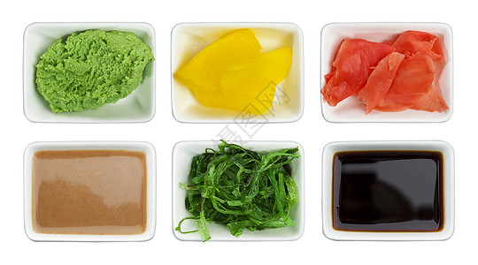 日本寿司香料 白色背景中突显的酱油 芥末 腌姜 chuka 芝麻酱和腌萝卜图片
