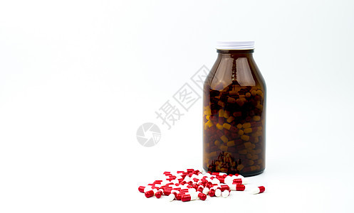 红色 白色抗生素胶囊药丸和琥珀色玻璃瓶隔离在白色背景上 带有复制空间和空白标签 耐药性 抗生素用药合理搭配 医药行业 药房背景 图片