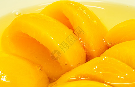 糖浆里有闭合的罐头桃子 黄水果饮食沙拉甜点食物营养橙子小吃工作室热带黄色图片