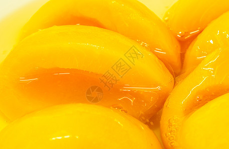 糖浆里有闭合的罐头桃子 黄水果小吃工作室甜点黄色饮食营养食物沙拉热带橙子图片