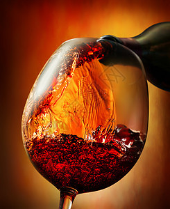 橙色背景的红葡萄酒派对餐厅运动美食酒杯奢华酒精气泡酒厂液体图片