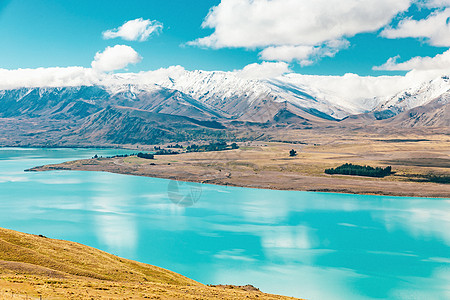 来自新西兰约翰山的Tekapo湖视图风景蓝色季节粉色公吨爬坡反射旅行旅游天空图片