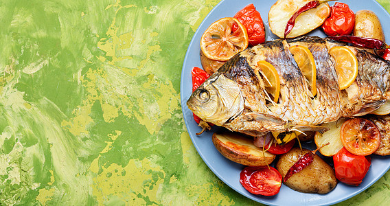 用蔬菜制成的鱼饮食厨房服务炙烤美食午餐海鲜烘烤乡村柠檬图片