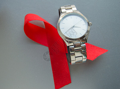世界艾滋病日 红丝带和时钟的象征不要浪费时间开始治疗团结免疫斗争健康癌症疾病组织帮助缺陷行动图片
