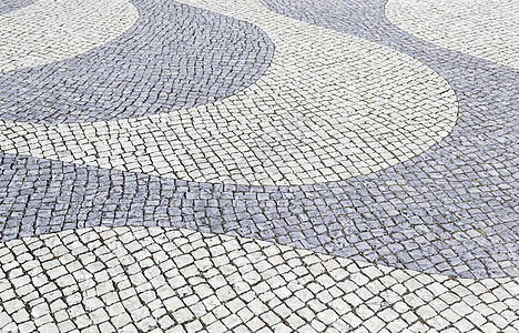 典型的里斯本石地板鹅卵石建筑学对称海浪园林正方形铺路文化石头地面图片