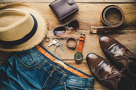 旅行必备服饰男人钱包眼镜皮革商业男性帽子夹克棕色手表图片
