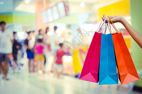 在购物商场装有购物袋的妇女女士零售衣服化妆品女性顾客精品女孩店铺购物者图片