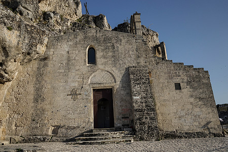 在 Matera  石头 上查看历史建筑物洞穴村庄遗产建筑学城市全景建筑景观图片