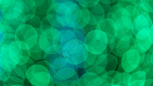 抽象的节日背景魔法墙纸白色辉光绿色星星圆圈耀斑图片