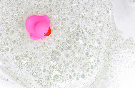 浴缸里的粉鸭漂浮鸭子橡皮温泉洗澡气泡孩子们肥皂玩具浴室图片