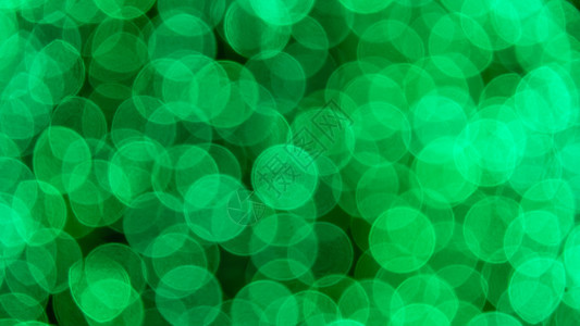 抽象的节日背景辉光耀斑绿色星星魔法圆圈白色墙纸图片