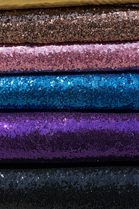各种颜色的鲜艳织物示例面料棉布家具纺织品裁缝材料缝纫店铺背景图片