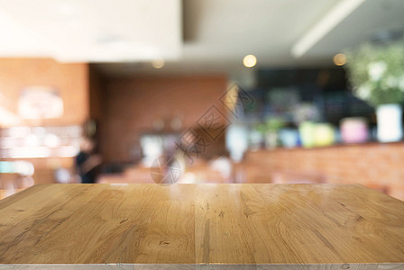 空木制桌 在抽象模糊的CO背景前餐厅厨房咖啡柜台硬木产品建筑购物中心零售嘲笑图片