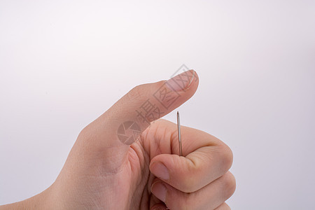 手握针头接缝纺织品乐器针线活缝纫裁缝别针工具穿线手工图片