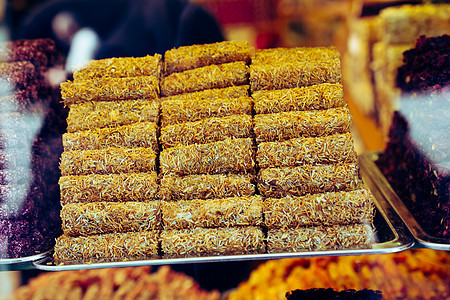 土耳其的喜悦或花环是一个以凝胶为基础的甜食家庭甜点食物文化粉状粉末坚果火鸡红色宏观小吃图片