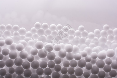 作为背景的白色聚苯乙烯泡沫球惊喜材料防震派对宏观节日商品玩具庆典包装背景图片