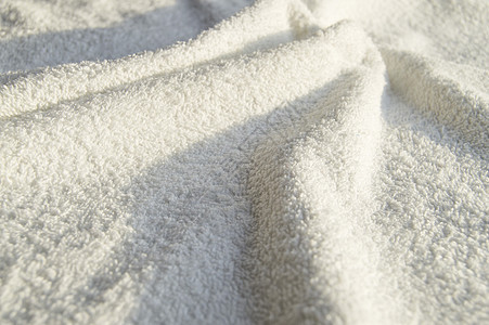 用于 SPA 治疗的白色特里软毛巾纹理背景织物淋浴尾巴身体卫生营养纺织品配件褶皱材料图片