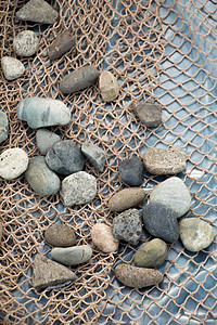 小鹅卵石的背景纹理鹅卵石墙纸卵石灰色花岗岩岩石铺路石头花园碎石图片
