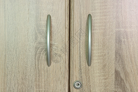 棕色木制衣柜抽屉 有一个钥匙孔图片
