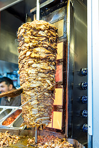 切切土耳其传统食品主厨Shawarma鸡捐赠者美食陀螺仪烧烤男人午餐食物炙烤烹饪火鸡图片