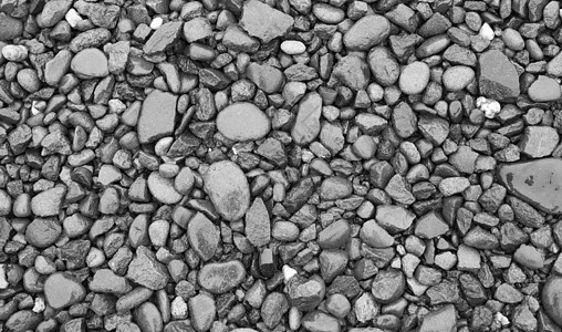 湿鹅卵石背景圆形碎石花园黑色矿物墙纸花岗岩灰色卵石石头图片