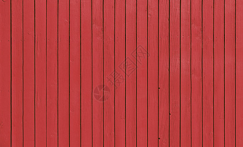 带平行木板的木栅栏 涂有红漆图片