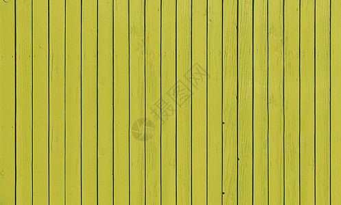 带平行木板的木栅栏 涂有黄色油漆图片