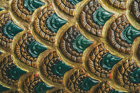 泰国寺庙中蛇的雕塑图案 概念o国王佛教徒建筑学墙纸工艺宗教身体艺术钦佩皮肤背景图片