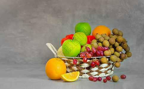 蔬菜和结菜的果实白色柳条产品桂圆篮子饮食橙子收成植物绿色图片
