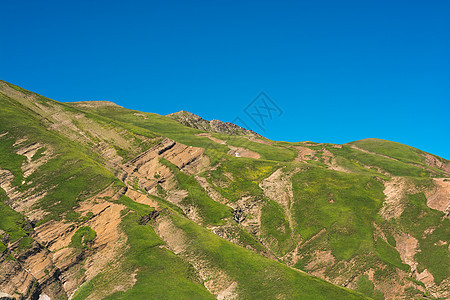 土耳其高原山岳的景象天空草地悬崖岩石太阳蓝色爬坡高地场景美丽图片