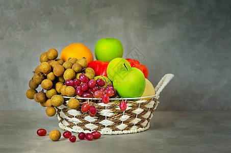 蔬菜和结菜的果实橙子柳条桂圆篮子植物营养水果产品白色绿色图片